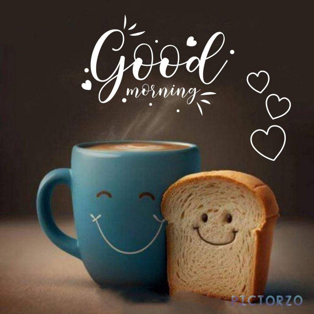 A cup of hot tea with a slice of bread and the text Good morning on a brown background. The tea is in a blue mug with smile in mup and bread