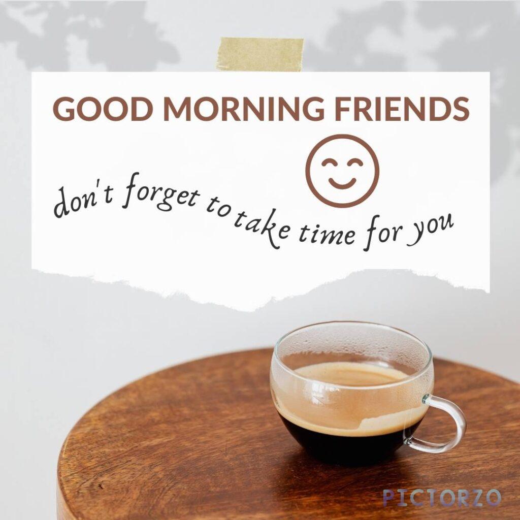 A cup of steaming coffee on a wooden table, with the text Good morning friends