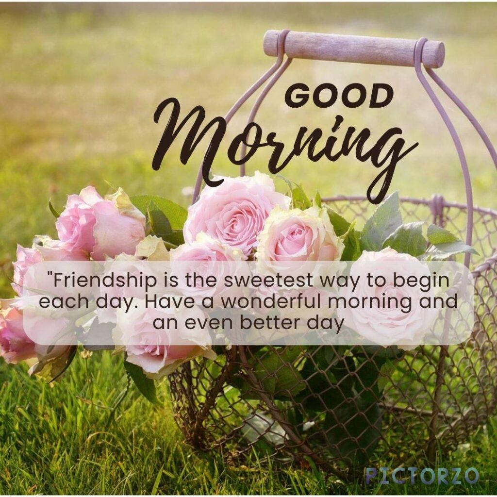 A good morning image with a group of diverse friends sitting in a circle, laughing and talking. The text "Good Morning!" and "Friendship is the sweetest way to begin each day" are superimposed on the image in a cursive font