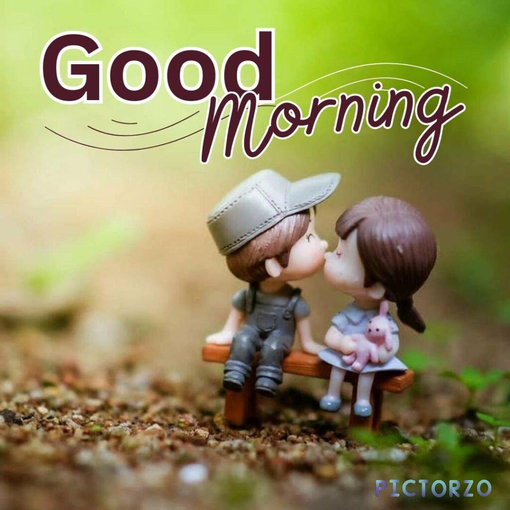 he woman is wearing a pink dress and the man is wearing a blue shirt. There is a tree with green leaves behind them. Good morning love images 4