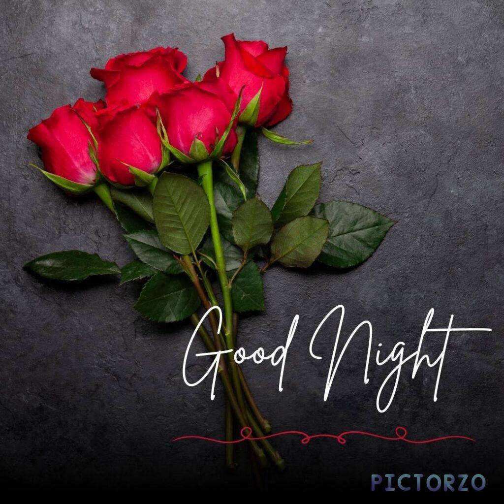 A bouquet of red roses on a black background with the words "good night" written on it. The roses are a symbol of love, romance, and passion, and the black background creates a sense of mystery and intrigue. The image conveys a message of good night and sweet dreams, and it is perfect for sharing with a loved one