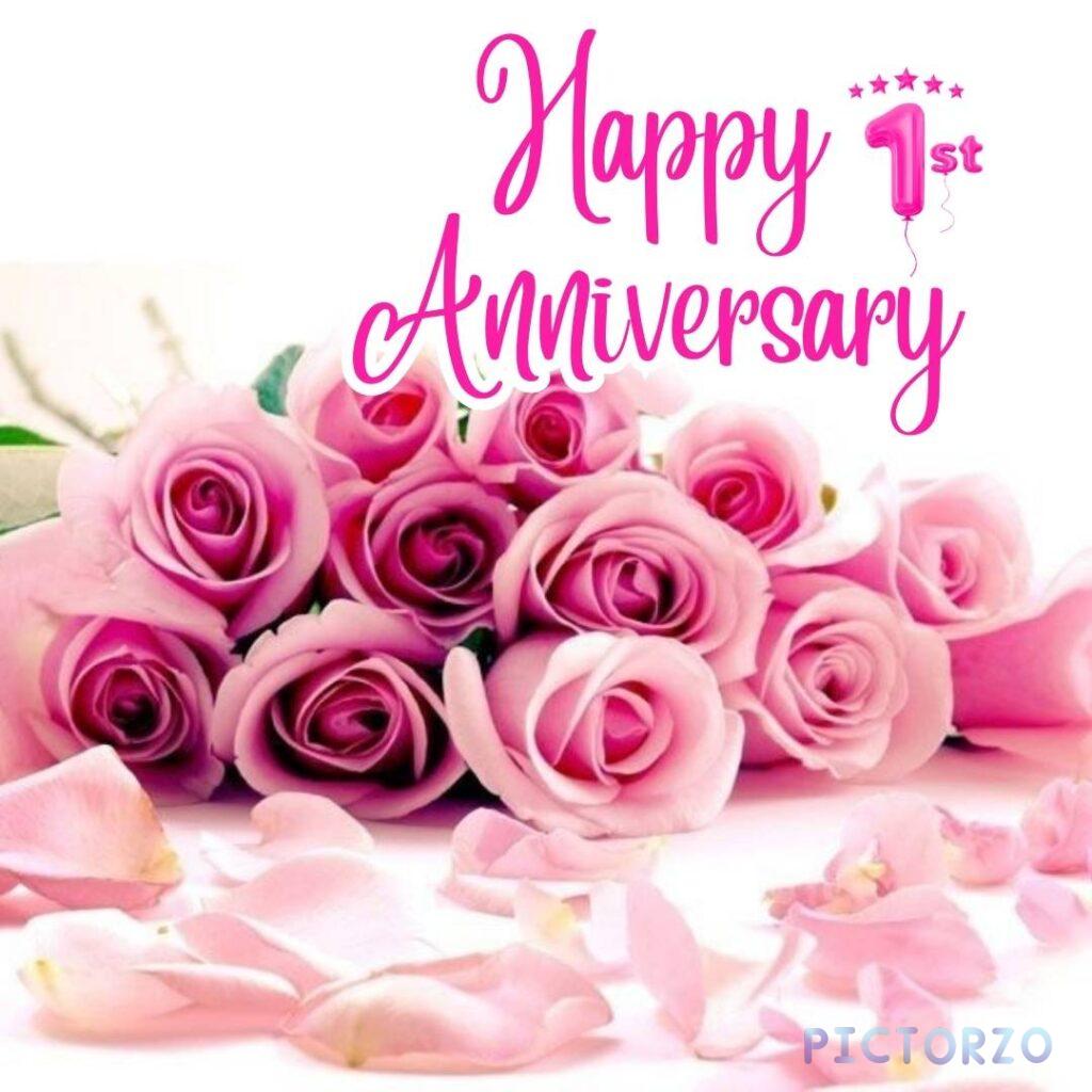 A close-up photo of a bouquet of pink roses on a table. The roses are arranged in a vase and have a ribbon tied around them. There is a card in the vase that reads Happy Anniversary.