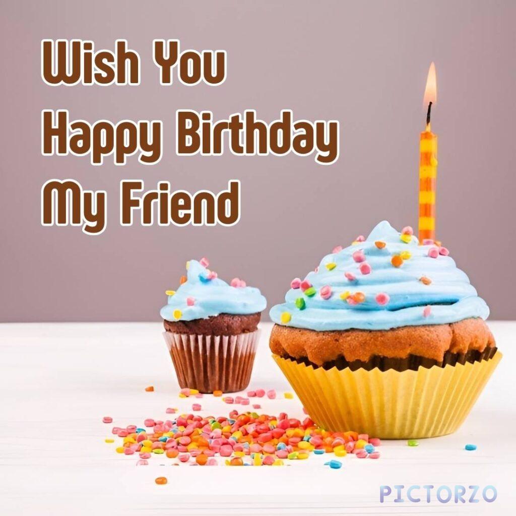 A close-up photo of a cupcake with a lit candle on top. The cupcake is decorated with frosting and sprinkles. There is text on the cupcake that reads Wish You Happy Birthday My Friend