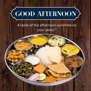 A delicious and colorful Indian thali meal, perfect for a good afternoon lunch. The thali includes a variety of vegetarian dishes, such as rice, dal, naan bread, paneer, chole, raita, all served on a round metal tray. The text "GOOD AFTERNOON" is written in the center of the tray.