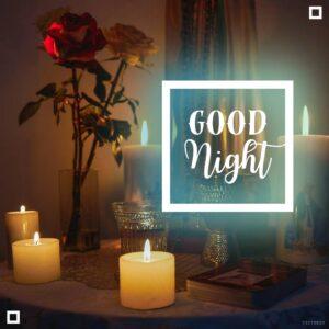 Good Night Flower Images 16 Image of a table with a bunch of lit candles, a vase of roses, and the text GOOD Night in the background