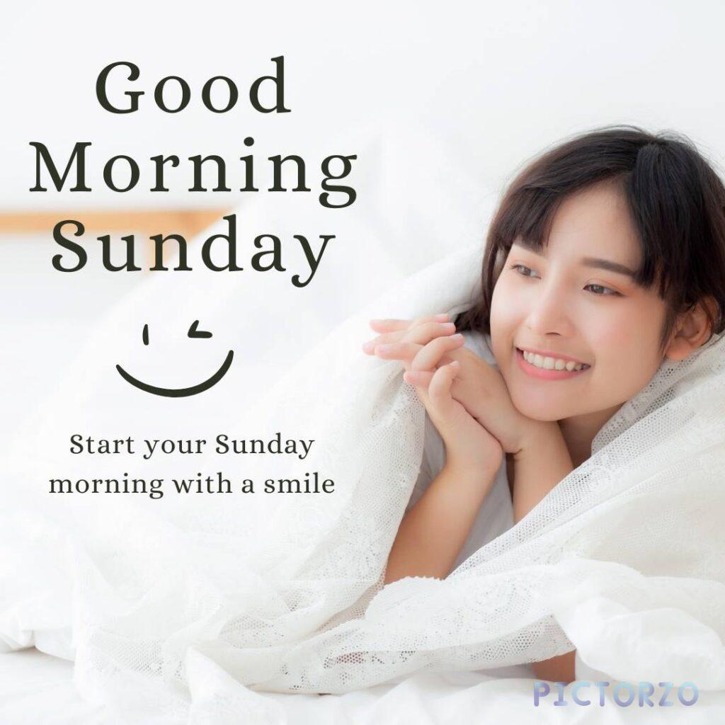 Good Morning Sunday text overlay on an image. The text reads 'Good Morning Sunday' in large, bold letters and 'Start your Sunday morning with a smile' in smaller text below.