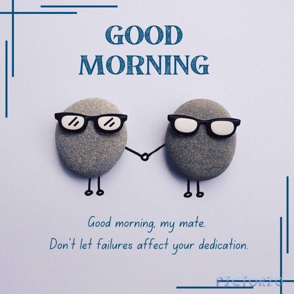 A photo with a handwritten message in black and white calligraphy against a textured gray background. The text reads Good morning, my mate. Don't let failures affect your dedication. The photo has a warm and encouraging feel to it.