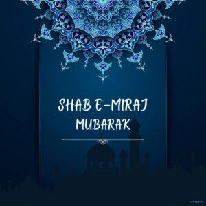 A blue background with a floral pattern and a silhouette of a mosque. The text Shab e Miraj Mubarak is written in the center of the image in white Arabic calligraphy
