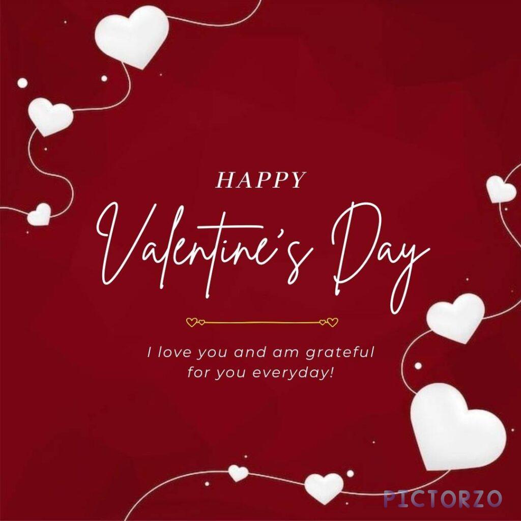 A digital image with a pink and red background. In the center of the image is the text "HAPPY VALENTINE'S DAY" in large, white font. Below the text is a smaller message in pink font that reads "I love you and am grateful for you everyday!" A red heart sits between the two messages.