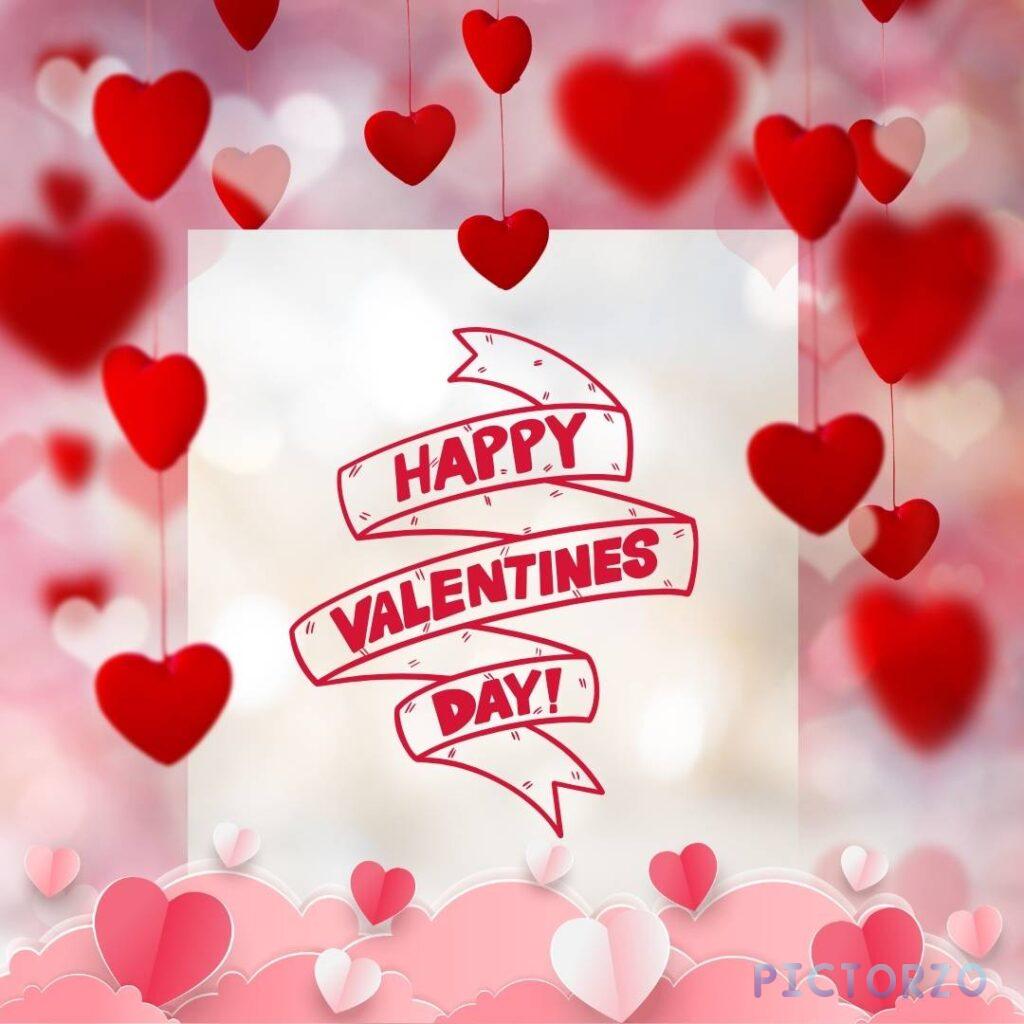 A red message with a heart shape in the background. The message reads Happy Valentine's Day! in glittery, pink text with a red heart to the right.