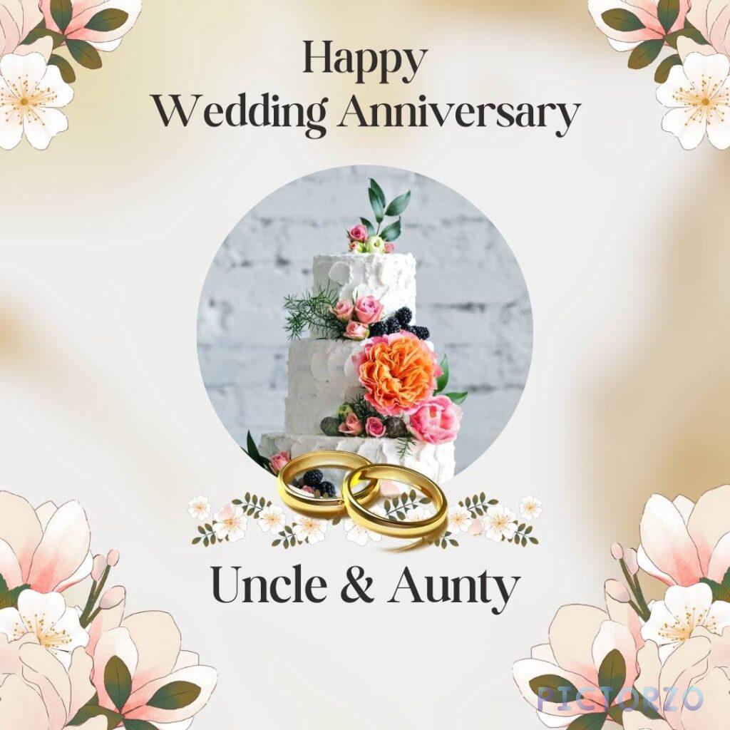 A white background with a two-tiered wedding cake decorated with pink and purple frosting. On top of the cake are two silver wedding rings and a pink rose. The text "Happy Wedding Anniversary Uncle & Aunty"